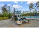 Playground featuring slides and a nearby pool within the community at 1560 Swing Bridge Way, Myrtle Beach, SC 29588