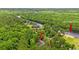 Serene aerial view of a riverside home surrounded by lush greenery along the Waccamaw River at 1936 Lees Landing Circle, Conway, SC 29526