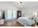 Bright bedroom with ensuite bathroom and double doors leading to a balcony at 1936 Lees Landing Circle, Conway, SC 29526