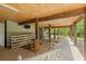 Relaxing covered patio features rustic bar and outdoor seating, perfect for entertaining guests at 1936 Lees Landing Circle, Conway, SC 29526