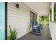 Inviting front porch with rocking chairs, offering a relaxing outdoor space with a peaceful ambiance at 1936 Lees Landing Circle, Conway, SC 29526