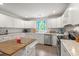 Bright kitchen features white cabinets, granite counters, stainless steel appliances, and center island at 1936 Lees Landing Circle, Conway, SC 29526