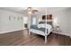 Spacious main bedroom features a stylish four poster bed and nautical decor at 1936 Lees Landing Circle, Conway, SC 29526