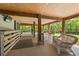 Outdoor area underneath elevated house with bar and seating for entertainment at 1936 Lees Landing Circle, Conway, SC 29526