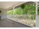 Enjoy the view from this spacious porch and the lush trees nearby at 1936 Lees Landing Circle, Conway, SC 29526
