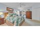 Comfortable bedroom with a tropical themed comforter set, natural lighting and hardwood furniture at 196 John Waites Ct., Georgetown, SC 29440