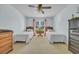 Bright bedroom featuring two twin beds, neutral carpeting, and soft blue wall paint at 196 John Waites Ct., Georgetown, SC 29440
