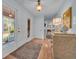 Entryway featuring wood floors, a vintage dresser with a lamp, and a view to the front yard at 196 John Waites Ct., Georgetown, SC 29440