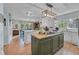 Bright kitchen with island, marble countertops, stainless steel appliances, and hardwood floors at 196 John Waites Ct., Georgetown, SC 29440