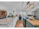 Bright kitchen with island, marble countertops, stainless steel appliances, and hardwood floors at 196 John Waites Ct., Georgetown, SC 29440