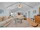 Cozy living room featuring a vaulted ceiling, wood floors, and neutral-toned furniture at 196 John Waites Ct., Georgetown, SC 29440