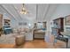 Bright and airy living room featuring a vaulted ceiling, wood floors, and neutral-toned furniture at 196 John Waites Ct., Georgetown, SC 29440