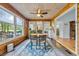 Inviting sunroom with wood paneling, multiple windows, and access to the outdoors at 196 John Waites Ct., Georgetown, SC 29440