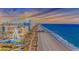 Stunning aerial view featuring the coastline, pier, ferris wheel, and scenic Myrtle Beach landscape at 2000 N Ocean Blvd. # Ph 15, Myrtle Beach, SC 29577