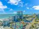 Stunning aerial view showcasing the city skyline, beachfront, amusement park, and vibrant cityscape on a clear day at 2000 N Ocean Blvd. # Ph 15, Myrtle Beach, SC 29577