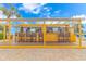 Outdoor bar area featuring seating, drinks, and menu options for relaxing by the beach or pool at 2000 N Ocean Blvd. # Ph 15, Myrtle Beach, SC 29577