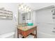 Well-lit bathroom featuring granite countertop vanity, shower, and seashell decor at 2000 N Ocean Blvd. # Ph 15, Myrtle Beach, SC 29577