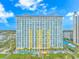 Beautiful oceanfront high-rise building with multiple balconies, pool area, and tropical landscaping offering resort-style living at 2000 N Ocean Blvd. # Ph 15, Myrtle Beach, SC 29577