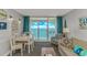 Inviting living room with ocean view from the balcony featuring stylish furniture at 2000 N Ocean Blvd. # Ph 15, Myrtle Beach, SC 29577