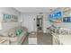 Comfortable living room featuring light gray walls and a partial view into the kitchen at 2000 N Ocean Blvd. # Ph 15, Myrtle Beach, SC 29577