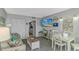 Comfortable living room featuring light gray walls and a partial view into the kitchen at 2000 N Ocean Blvd. # Ph 15, Myrtle Beach, SC 29577