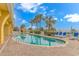 Inviting outdoor pool with lounge chairs, set against a backdrop of palm trees and clear blue skies at 2000 N Ocean Blvd. # Ph 15, Myrtle Beach, SC 29577