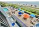 Overhead view of a condo pool, lounge area and beach for fun vacation experiences at 2001 S Ocean Blvd. # 303, Myrtle Beach, SC 29577