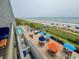 High-angle view of pool and lounge area with direct beach access for convenient vacationing at 2001 S Ocean Blvd. # 303, Myrtle Beach, SC 29577