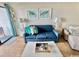 Comfortable living room featuring a plush sofa, side tables, and charming decor for a welcoming ambiance at 2001 S Ocean Blvd. # 303, Myrtle Beach, SC 29577