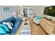 Bright living room with comfortable seating, flat-screen TV, and tile flooring at 2001 S Ocean Blvd. # 303, Myrtle Beach, SC 29577