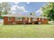 Brick home exterior with a well-maintained lawn, perfect for outdoor activities and relaxation at 2004 Seitter St., Georgetown, SC 29440