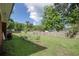 A large backyard showcasing green space, perimeter fencing and mature trees for privacy at 2004 Seitter St., Georgetown, SC 29440