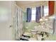 Vintage bathroom with seafoam green tile and colorful shower curtain at 2004 Seitter St., Georgetown, SC 29440