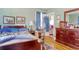 Bedroom featuring wooden furniture and bed with hardwood floors with an adjoining bathroom and walk-in closet at 2004 Seitter St., Georgetown, SC 29440