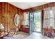 Wood paneled entryway with a decorative mirror, white tile flooring, and view to the outside at 2004 Seitter St., Georgetown, SC 29440