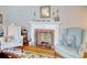 Classic fireplace with mantle, brick surround, and ornate metal screen at 2004 Seitter St., Georgetown, SC 29440