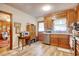 Kitchen featuring wooden cabinets, updated flooring, and stainless steel appliances with backyard access at 2004 Seitter St., Georgetown, SC 29440