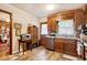 Kitchen featuring wooden cabinets, updated flooring, and stainless steel appliances with backyard access at 2004 Seitter St., Georgetown, SC 29440