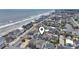 Aerial view of beach homes showcasing neighborhood, nearby waterway and ocean views at 204 33Rd Ave. N, North Myrtle Beach, SC 29582