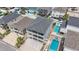 Aerial view of two-story home showcasing multiple pools and a patio area at 204 33Rd Ave. N, North Myrtle Beach, SC 29582