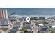 Aerial view of beach homes showcasing neighborhood, pool, and pier views at 204 33Rd Ave. N, North Myrtle Beach, SC 29582