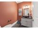 Stylish powder room featuring a vessel sink, granite countertop, and decorative bird artwork at 204 33Rd Ave. N, North Myrtle Beach, SC 29582