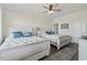Guest bedroom featuring two cozy beds with ceiling fan, creating a relaxing space at 204 33Rd Ave. N, North Myrtle Beach, SC 29582