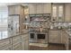 Gourmet kitchen with granite countertops, mosaic backsplash, and stainless steel appliances at 204 33Rd Ave. N, North Myrtle Beach, SC 29582