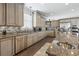 Well-equipped kitchen with stainless steel appliances, granite countertops, and custom cabinetry with ample storage at 204 33Rd Ave. N, North Myrtle Beach, SC 29582
