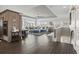 Spacious living room with a large sectional sofa, plush ottomans, and expansive windows for natural light at 204 33Rd Ave. N, North Myrtle Beach, SC 29582