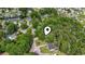 Aerial view highlighting the property's convenient location within a tranquil, wooded area at 203 Deer Trace, Myrtle Beach, SC 29588
