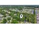 Aerial view showcasing the home's location nestled among lush trees and neighborhood setting at 203 Deer Trace, Myrtle Beach, SC 29588