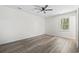 Spacious, airy bedroom featuring wood-look flooring, ceiling fan and a window at 203 Deer Trace, Myrtle Beach, SC 29588