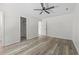 Bedroom with ceiling fan, closet with built-in shelving and wood-look floors at 203 Deer Trace, Myrtle Beach, SC 29588